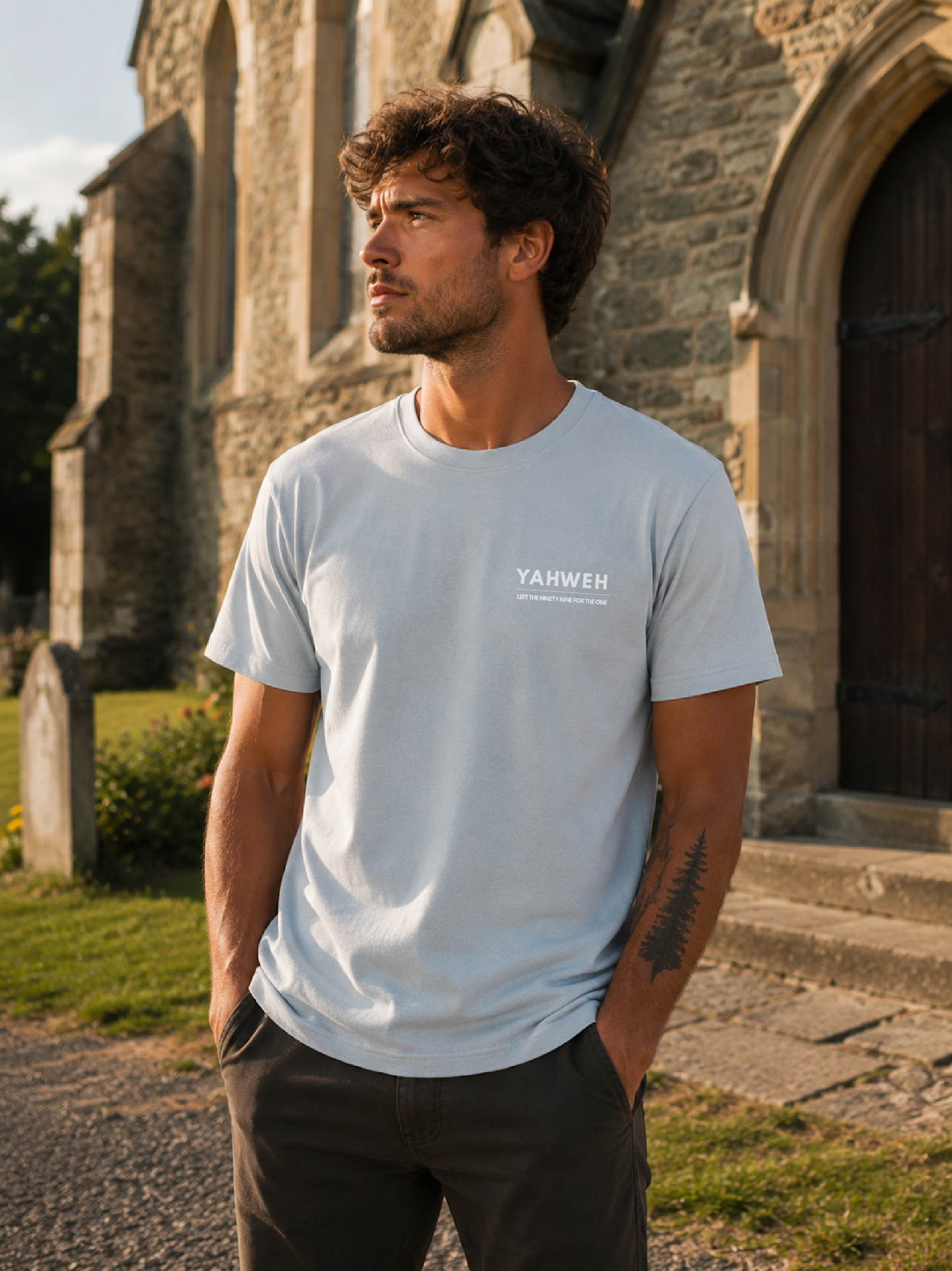 Yahweh Left The Ninety-Nine For The One T-Shirt Christian t-shirt, church doorway lifestyle shot | Face of Faith faith apparel